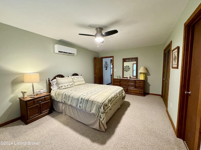 308 Oak Rd, Falls Of Rough, KY 40119 - bedroom with light colored carpet, a wall unit AC, ceiling fan, and a closet
