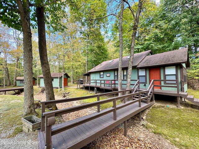 308 Oak Rd, Falls Of Rough, KY 40119 - exterior space featuring a storage unit, a deck, and a lawn