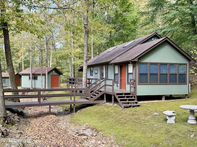 308 Oak Rd, Falls Of Rough, KY 40119 - chalet / cabin featuring roof with shingles, a deck, and an outbuilding