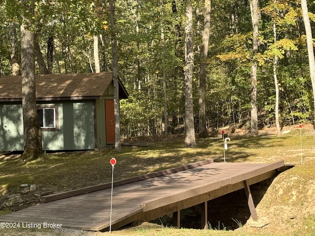 308 Oak Rd, Falls Of Rough, KY 40119 - wooden terrace featuring a storage shed and a view of trees