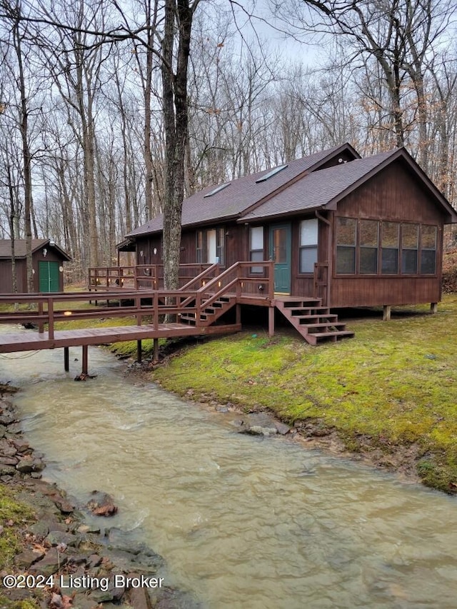 308 Oak Rd, Falls Of Rough, KY 40119 - back of property featuring a deck with water view and a sunroom