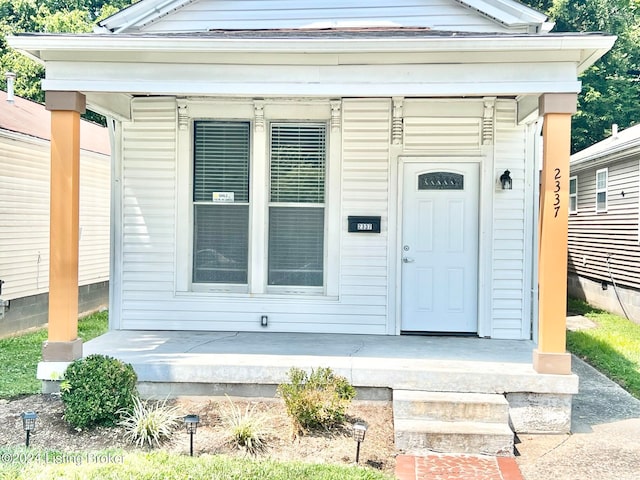 entrance to property with a porch