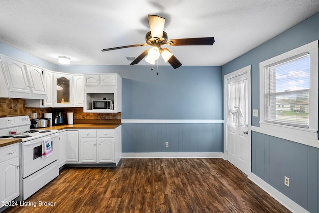 kitchen featuring white cabinets, electric range, dark wood-type flooring, and a textured ceiling