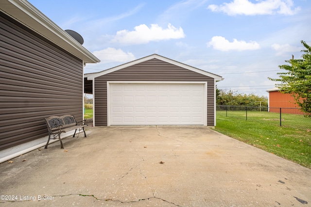 garage with a lawn