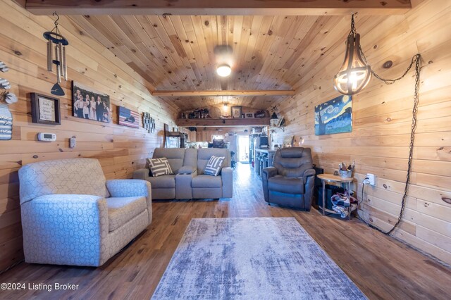 living room featuring wooden walls, wooden ceiling, vaulted ceiling, and wood finished floors