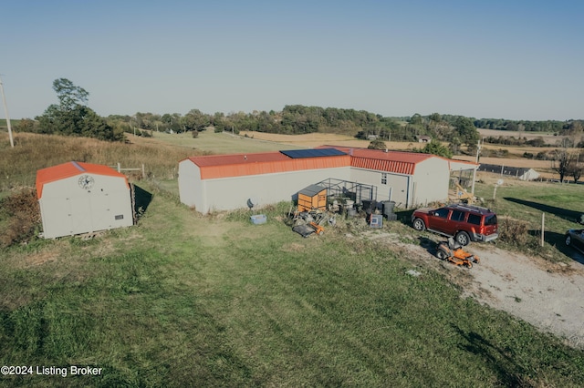 birds eye view of property featuring a rural view