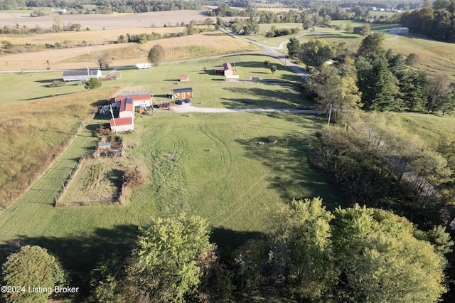 birds eye view of property with a rural view