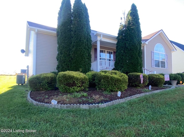 view of property exterior with central air condition unit and a lawn