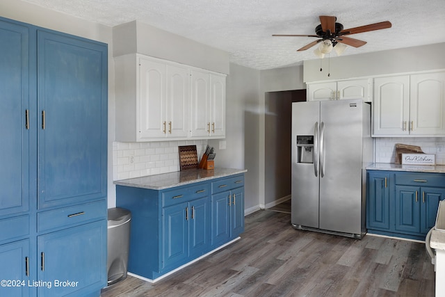 kitchen with stainless steel refrigerator with ice dispenser, white cabinets, and dark hardwood / wood-style floors