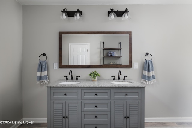 bathroom with vanity and hardwood / wood-style floors