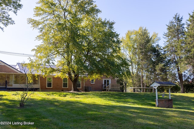 view of yard featuring a wooden deck