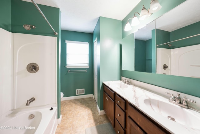 full bathroom featuring vanity, tile patterned floors, toilet, a textured ceiling, and shower / bathtub combination