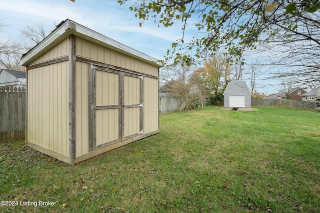 view of outbuilding featuring a yard