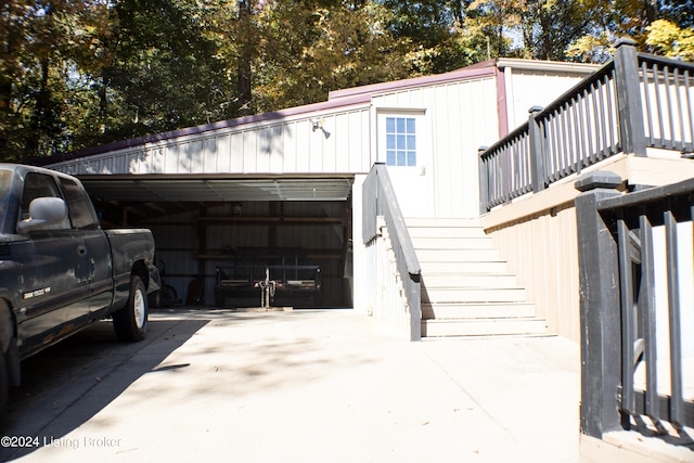 garage with concrete driveway