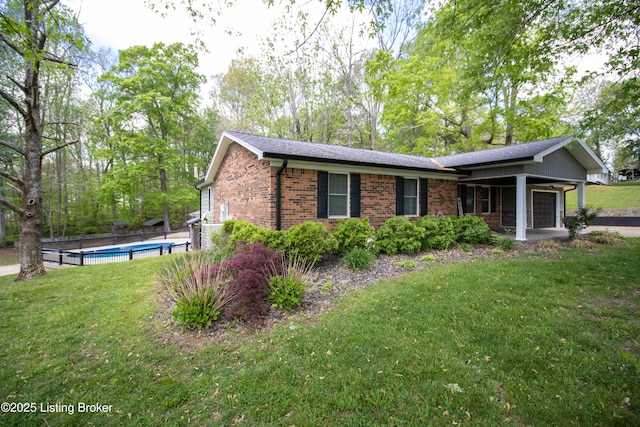 1353 Ferrill Hill Rd, Buffalo, KY 42716 - view of side of property featuring a garage, brick siding, a fenced in pool, and a yard