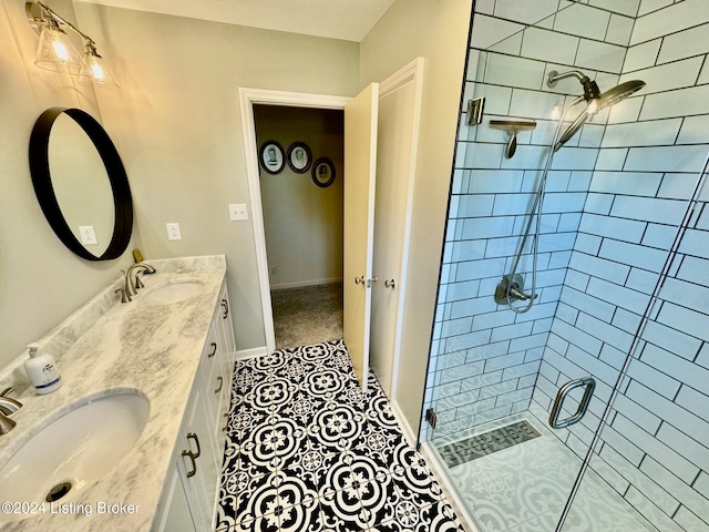 bathroom featuring vanity, tile patterned floors, ceiling fan, and an enclosed shower