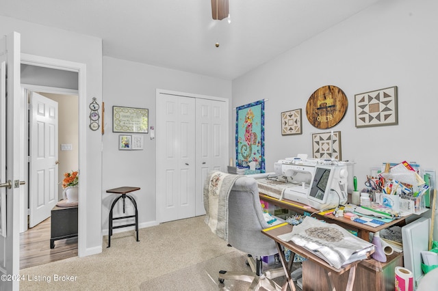 office space featuring light colored carpet and ceiling fan