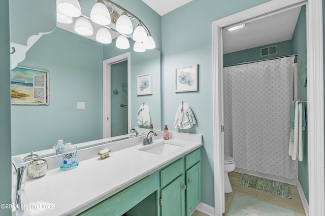 bathroom with vanity, curtained shower, toilet, and tile patterned floors