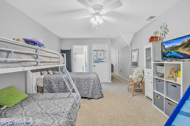 carpeted bedroom with a textured ceiling and ceiling fan