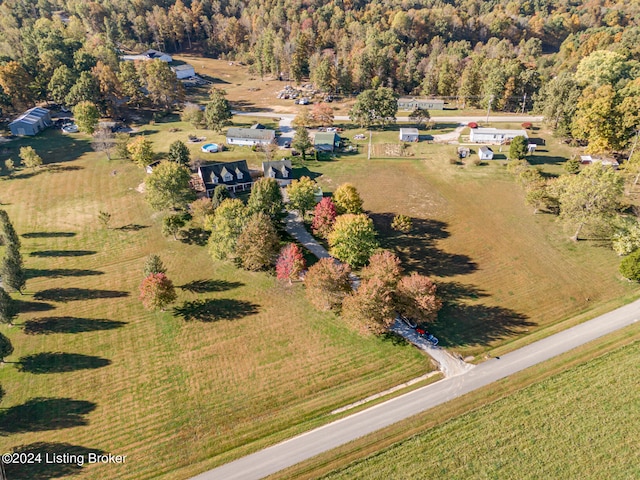 birds eye view of property with a rural view