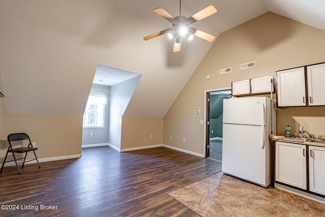 175 Boone White Rd, Leitchfield, KY 42754 - kitchen featuring freestanding refrigerator, lofted ceiling, wood finished floors, white cabinets, and ceiling fan