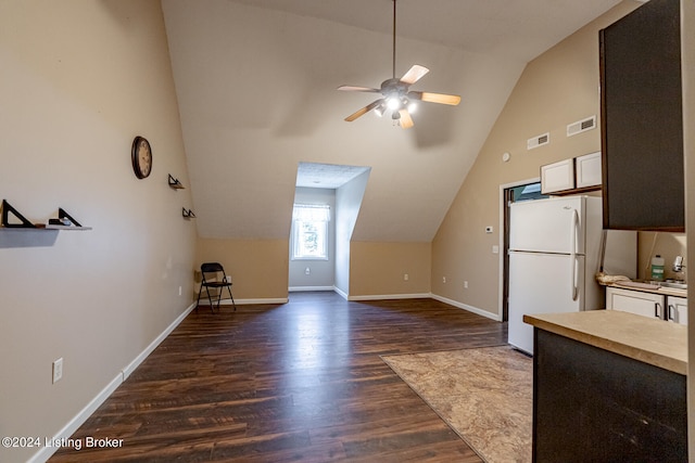 kitchen with dark hardwood / wood-style flooring, white cabinetry, ceiling fan, lofted ceiling, and white fridge