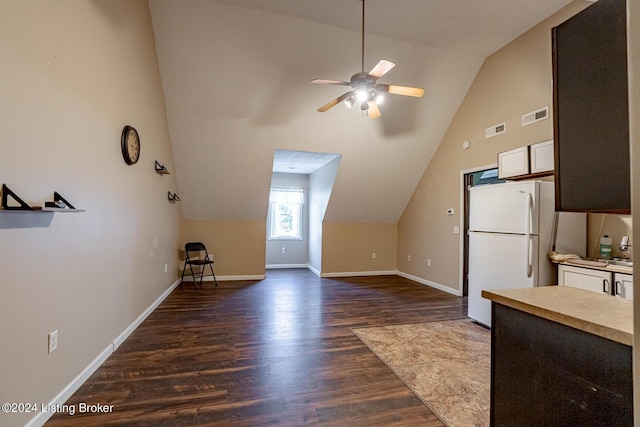 175 Boone White Rd, Leitchfield, KY 42754 - kitchen featuring freestanding refrigerator, vaulted ceiling, dark wood-type flooring, a ceiling fan, and white cabinetry