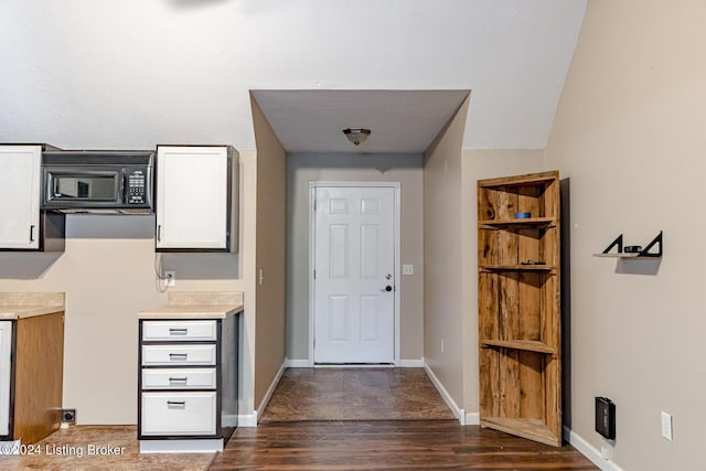 175 Boone White Rd, Leitchfield, KY 42754 - entrance foyer featuring dark wood-style flooring and baseboards