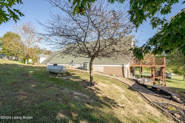 175 Boone White Rd, Leitchfield, KY 42754 - view of green lawn with stairway, central AC, and a deck