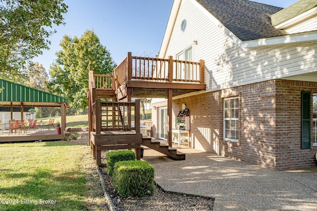 175 Boone White Rd, Leitchfield, KY 42754 - exterior space featuring a deck, a lawn, a shingled roof, stairway, and brick siding