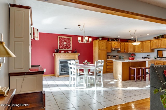 175 Boone White Rd, Leitchfield, KY 42754 - kitchen featuring stainless steel electric stove, light countertops, a kitchen island, light tile patterned floors, and hanging light fixtures