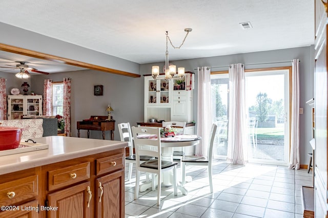 175 Boone White Rd, Leitchfield, KY 42754 - dining area with a chandelier, plenty of natural light, light tile patterned flooring, and a ceiling fan