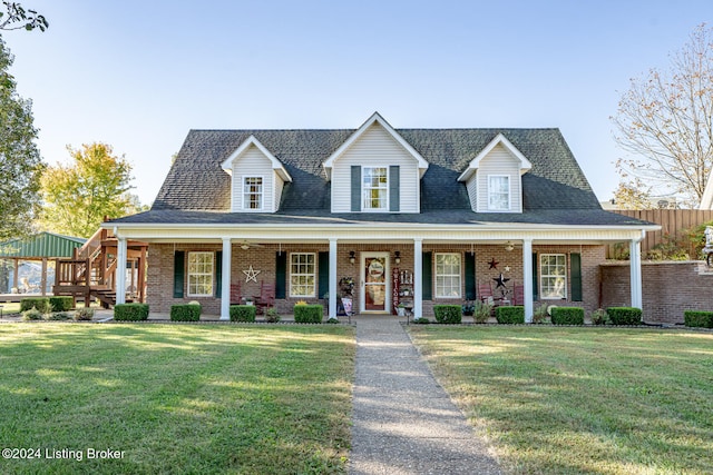 view of front of house with a front yard and a porch