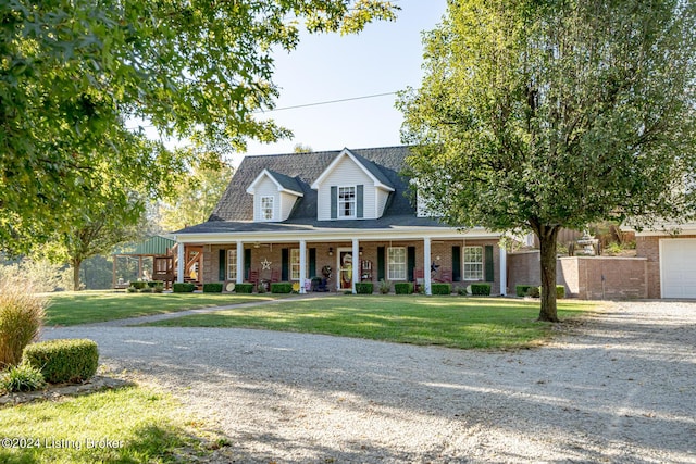 175 Boone White Rd, Leitchfield, KY 42754 - view of front of property with covered porch, brick siding, a front yard, and gravel driveway