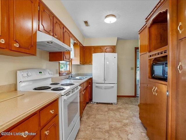 kitchen with sink and white appliances