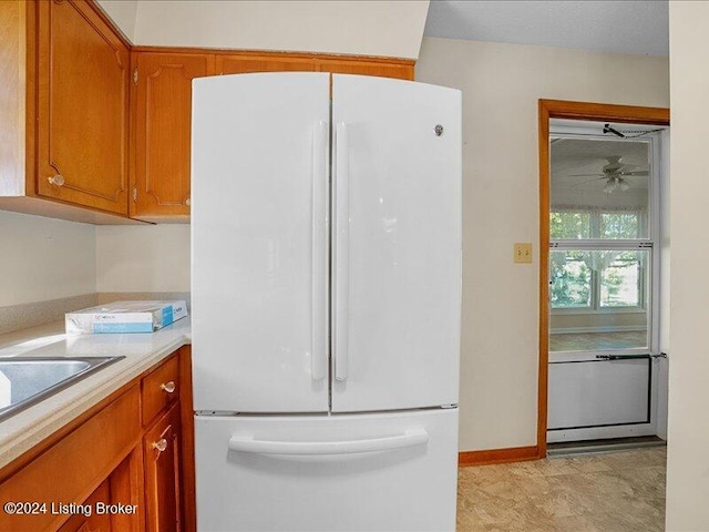 kitchen featuring white fridge and ceiling fan