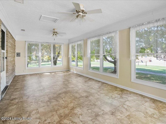 unfurnished sunroom with ceiling fan