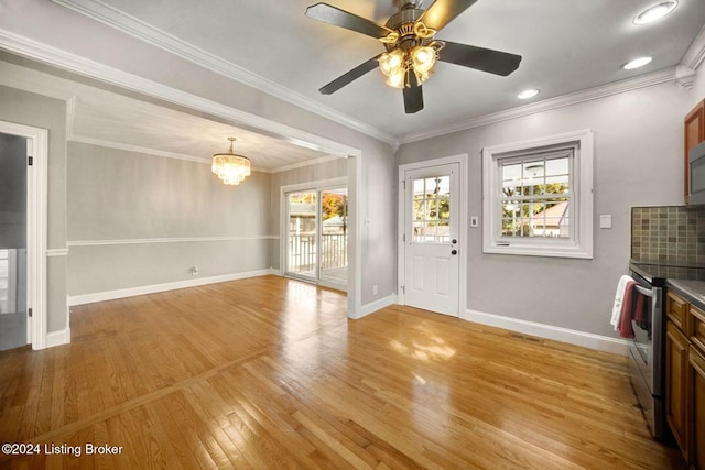 interior space with crown molding, light hardwood / wood-style flooring, and ceiling fan with notable chandelier