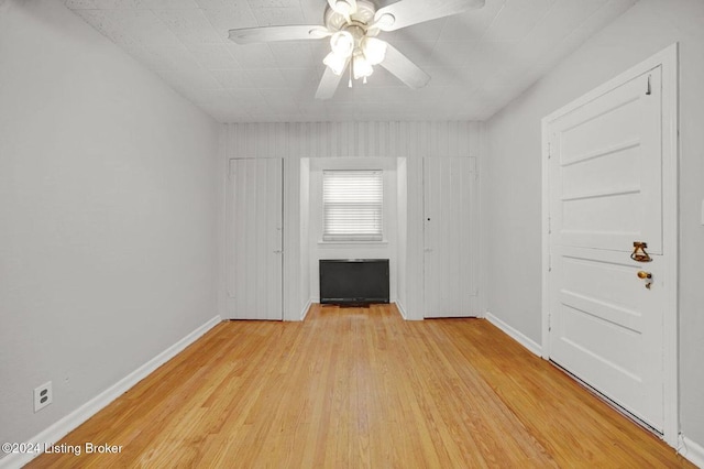 unfurnished room featuring ceiling fan and light hardwood / wood-style floors