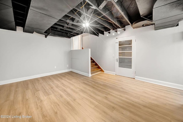 basement with hardwood / wood-style flooring