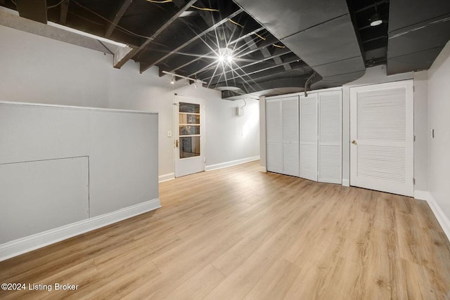 basement with hardwood / wood-style flooring