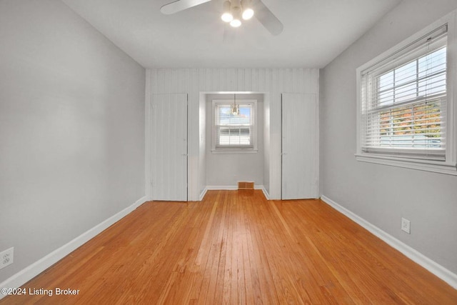 spare room featuring light hardwood / wood-style flooring and ceiling fan