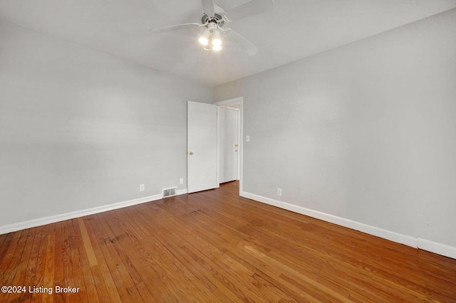 spare room featuring hardwood / wood-style floors and ceiling fan