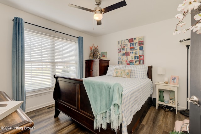 bedroom with dark wood-type flooring and ceiling fan