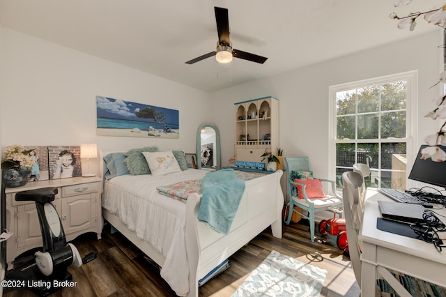 bedroom featuring ceiling fan and dark hardwood / wood-style floors