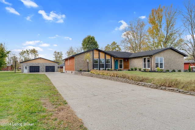 single story home featuring a garage and a front yard