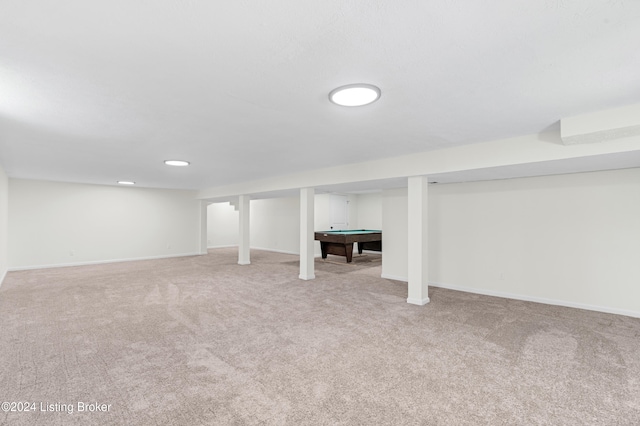 basement with light carpet and pool table