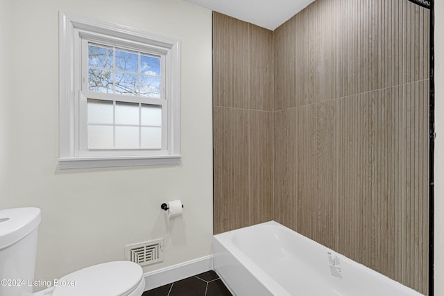 bathroom with tile patterned flooring and toilet