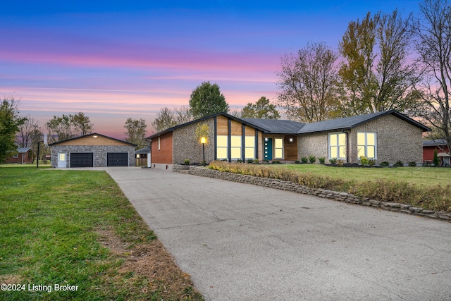 ranch-style home featuring a yard