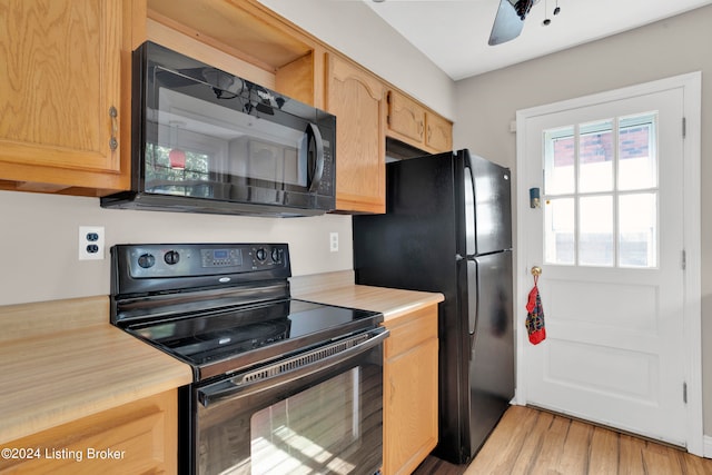 kitchen with ceiling fan, black appliances, and light wood-type flooring